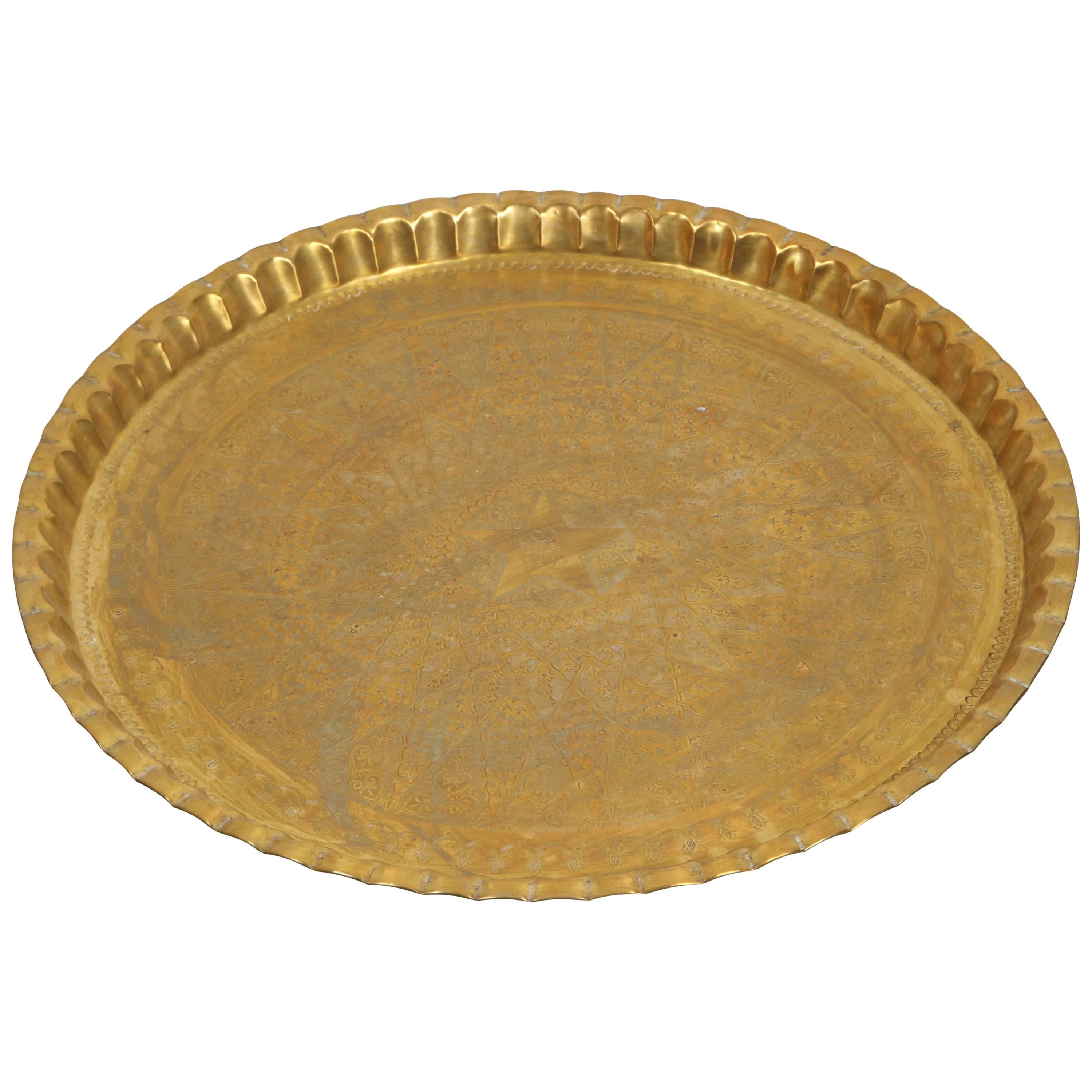 Large decorative Moorish brass tray, serving platter.
Middle Eastern hand-made and hand hammered in Syria by skilled artisans.
This nice brass tray is hand hammered with elaborate and fine Islamic geometric designs, with a star in the middle and pie