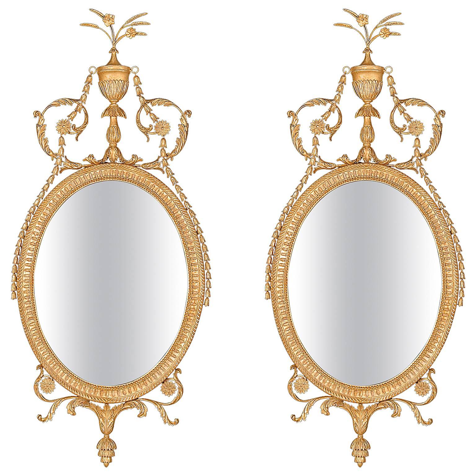 Pair of Oval Mirrors in the manner of Robert Adam For Sale