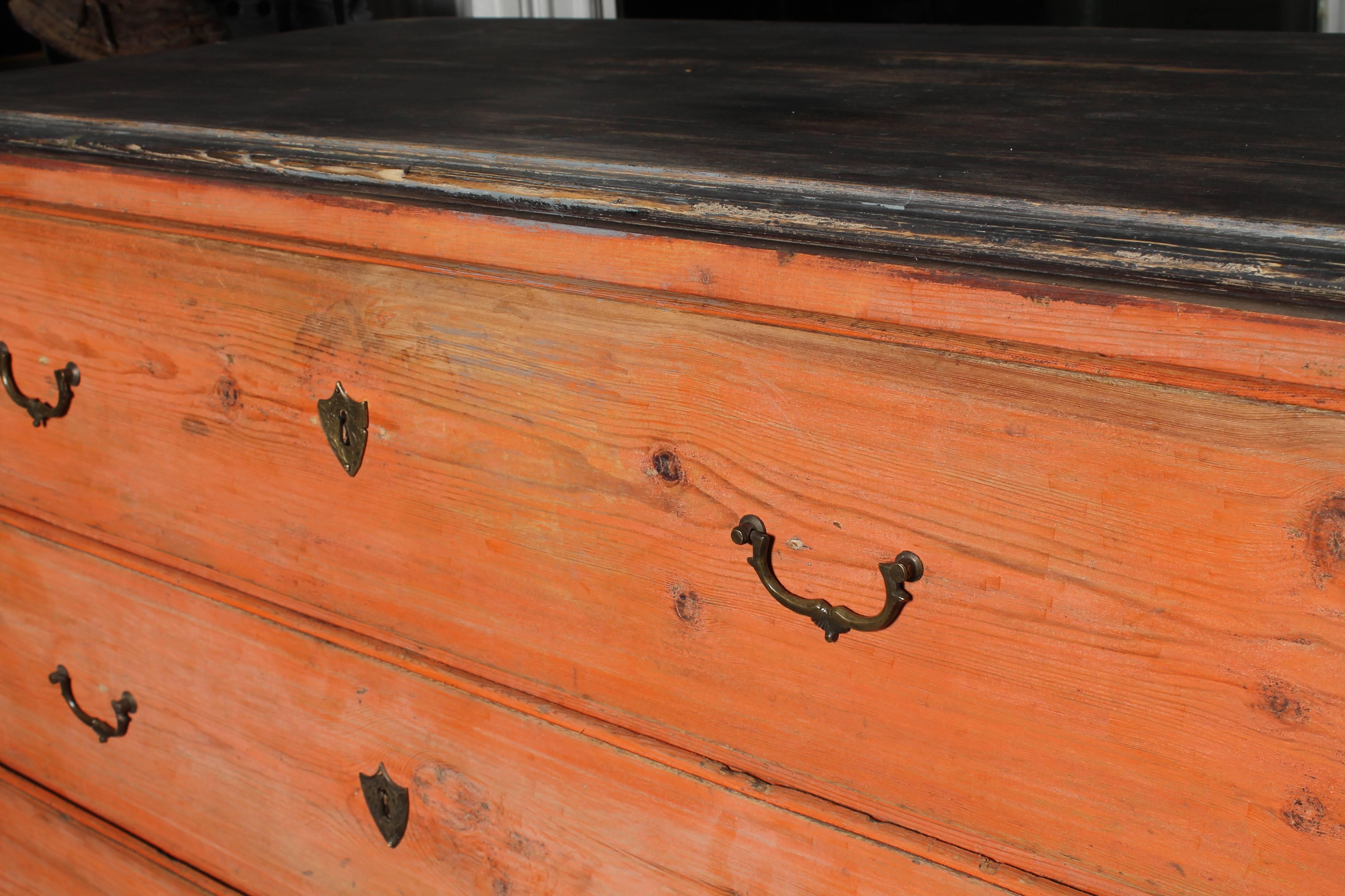 19th century Swedish chest of drawers, orange and black repainting, three drawers. Extraordinary painting which is typical for northern part of Sweden.