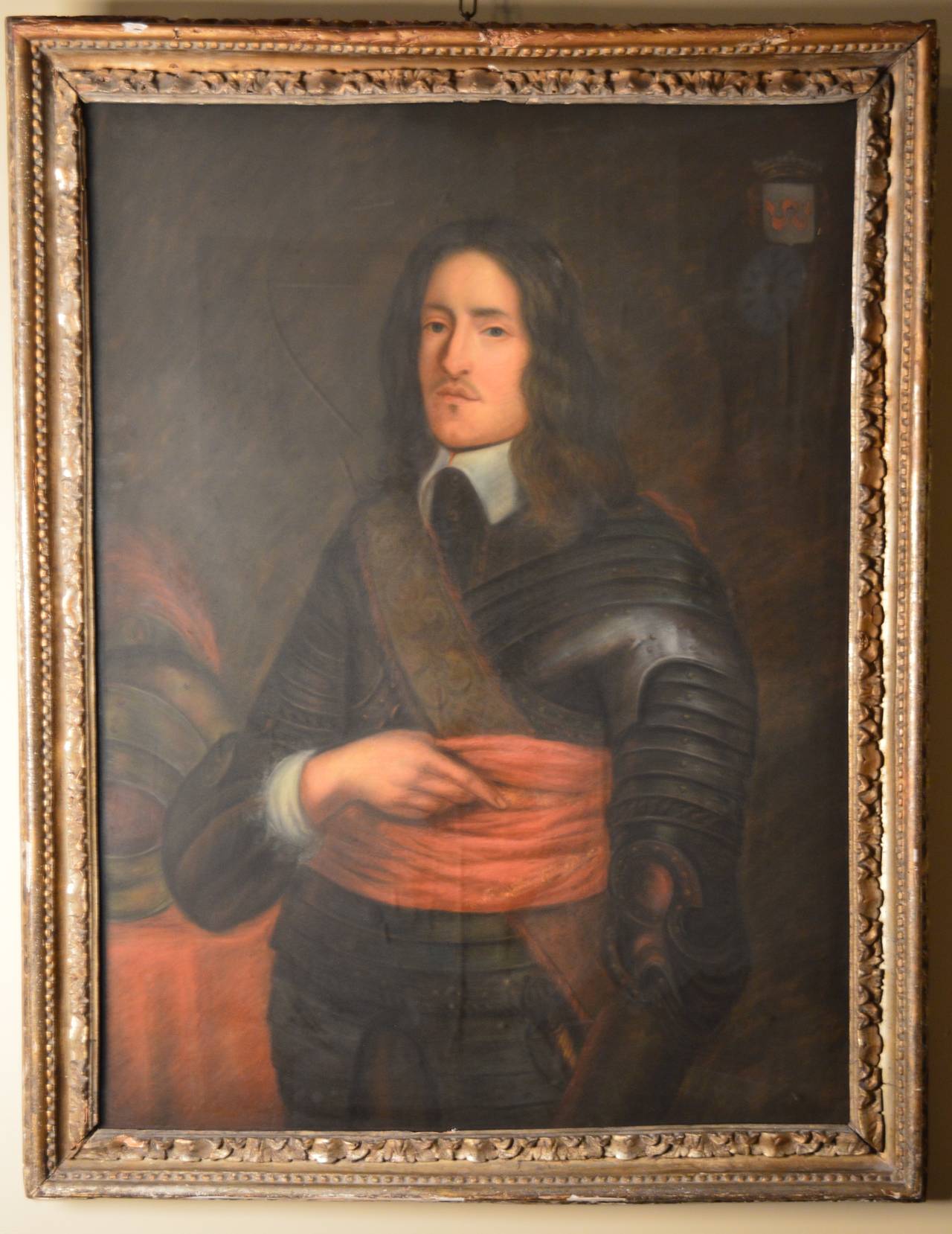 A portrait of a Nobleman drawn in chalk pastel on paper, circa 1790-1800, with armorial shield on the top right.
Framed under glass in the original 18th century Louis XVI carved wood frame.

Please note that the glass has many reflections that