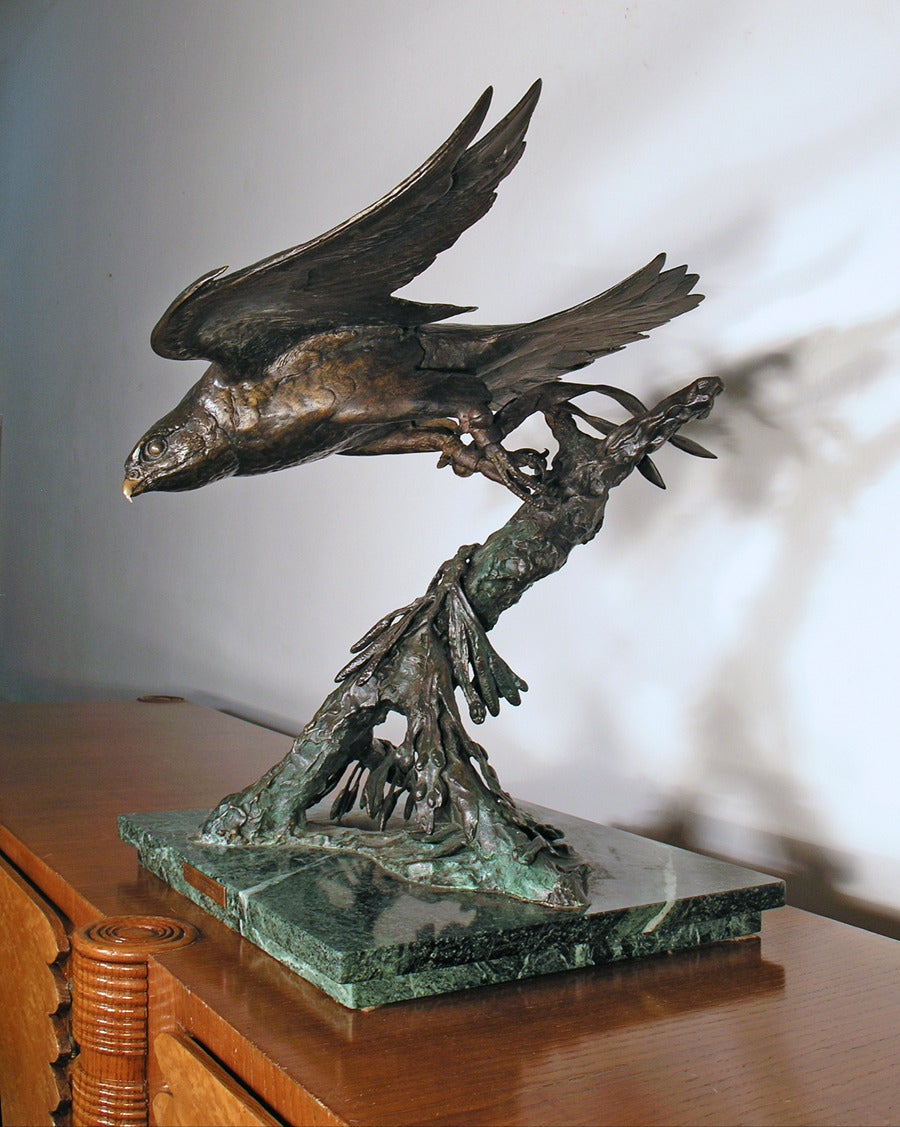 A superbly detailed large scale bronze depicting a falconer's peregrine flying from a naturalistic perch. Verdi marble base with engraved plaque.  Signed.

51cm high x 51cm deep x 77cm wide, base 37 x 39cm

James Alder (1920-2007)
Born in