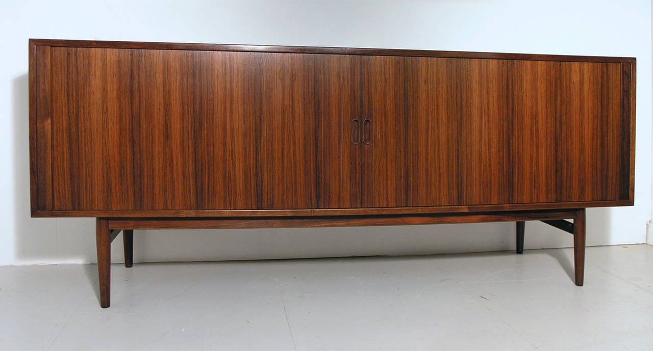 A tambour sideboard designed by Arne Vodder, Denmark, 1960s.  In excellent condition throughout. Sibast label present.
