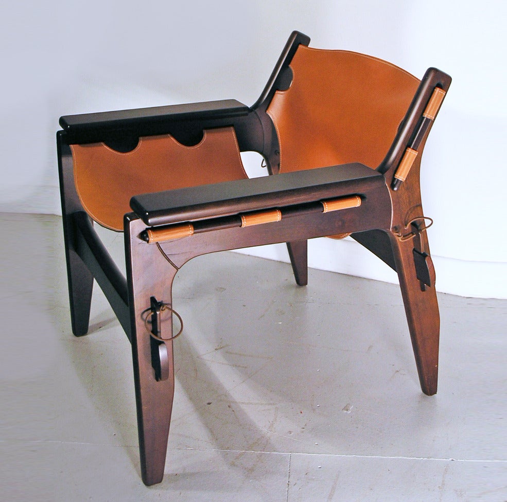 Genuine Kilin chair of recent manufacture, with label to rear.  Designed by Sergio Rodrigues, 1973.  Tan hide and pegged wood frame.