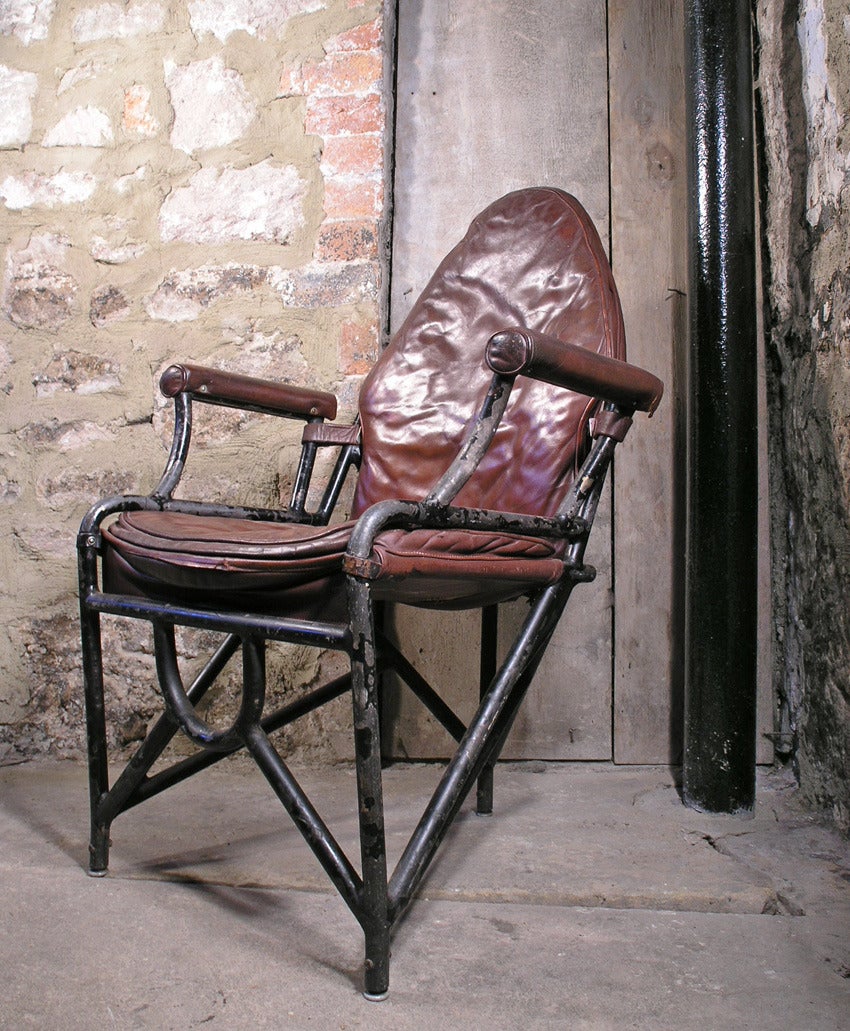 Leather and tubular metal aircraft armchair, dated 1944, manufactured by Avro Anson. Manufacturer's plate present. Rare officer's armchair model. Good condition with age appropriate wear to paintwork and leather. Interesting provenance with a D-Day