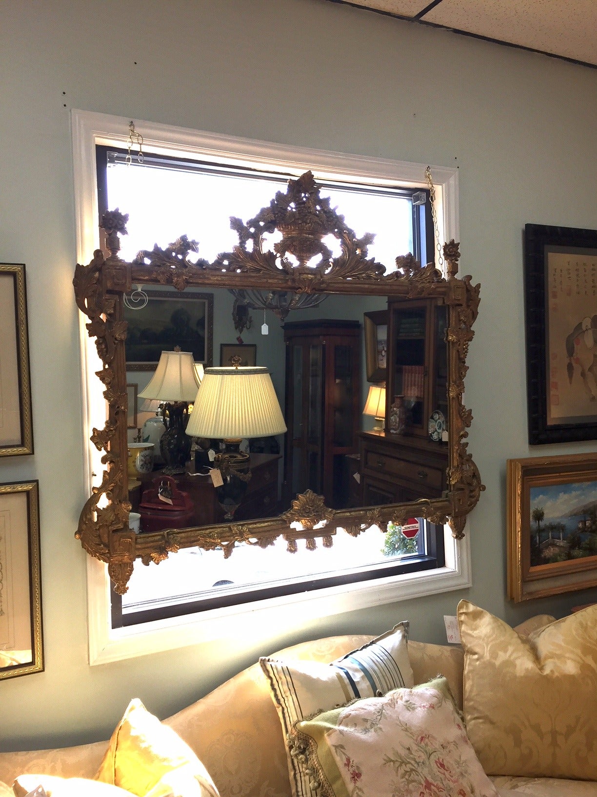 Gorgeous mirror with elaborate pediment richly carved in Rococo style. A perfect addition over the mantel, the bed or a comfy sofa. In perfect vintage condition.