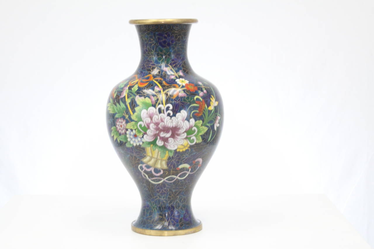 Wonderful 16 inch tall Royal Blue Cloisonne Vase which is done in a vibrant flower basket design.  Extremely colorful and attractive.  Large in size is also a rarity.  Excellent condition.  No  damage or loss.