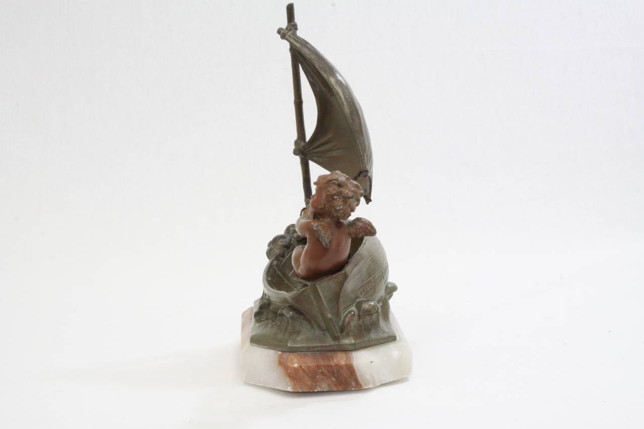 Auguste Moreau bronze and marble cherub in boat. Made of bronze, copper and marble. Signed on back of boat. 