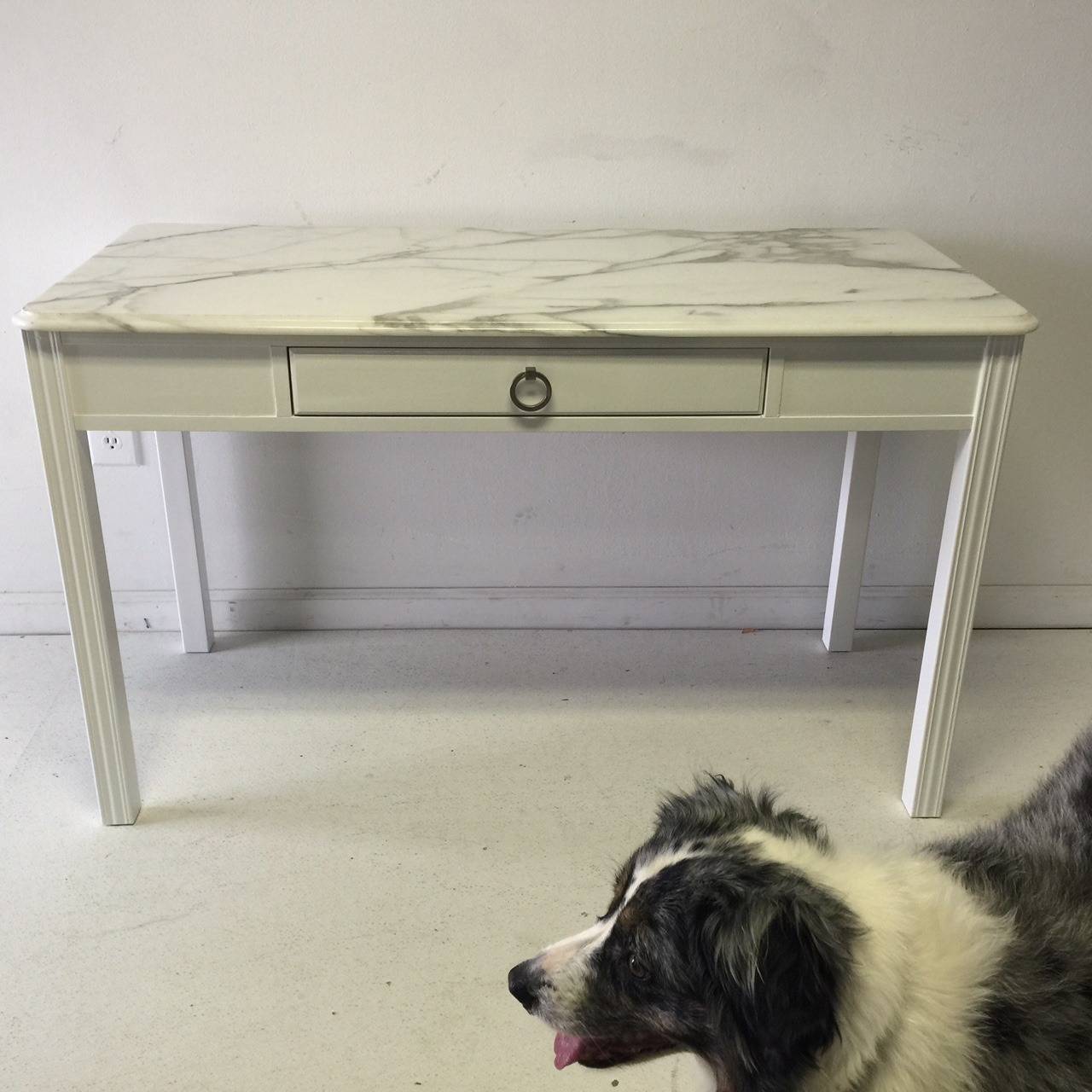 This Drexel desk would enhance a bedside, a bedroom, or most any living area and is large enough to hold a lamp and some great accessories.  It has been professionally lacquered in decorator white. The top has minor signs of age but no chips or