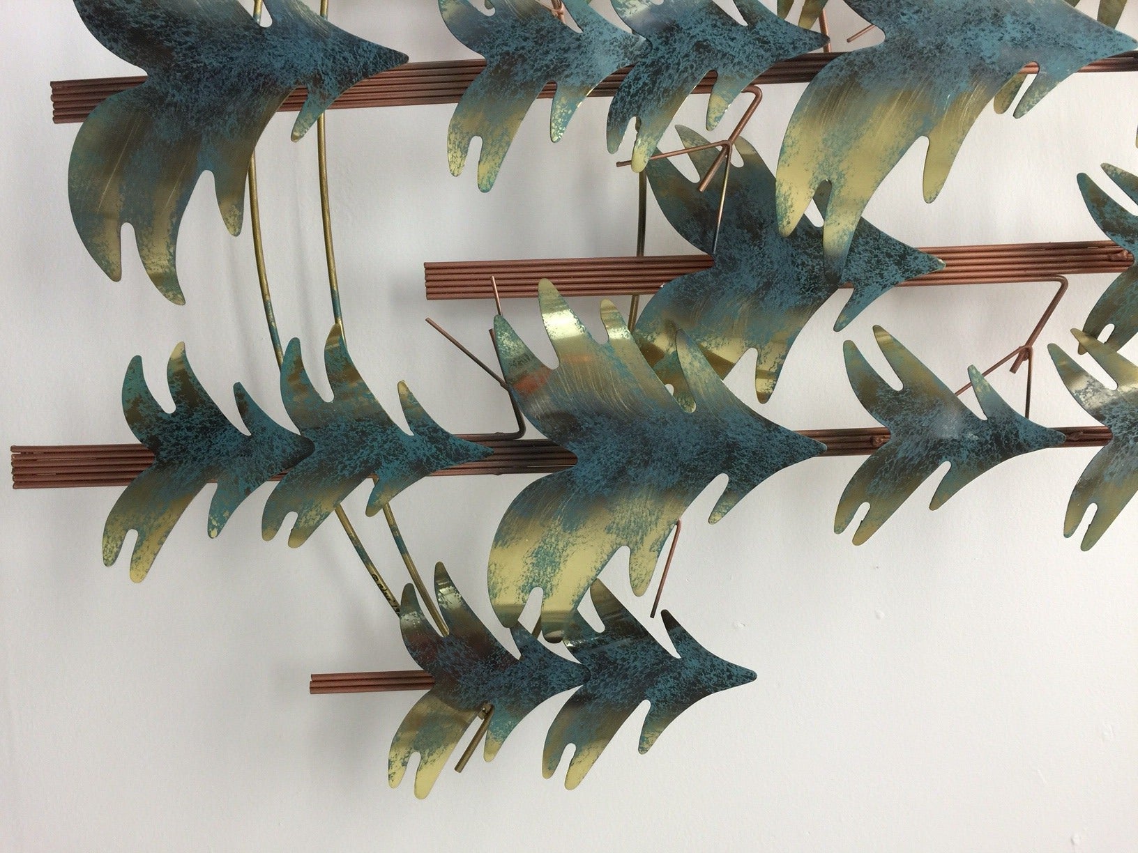 This signed Curtis Jere Wall Sculpture is in great condition and is comprised of copper and metal.  Although it has a bit of a fairy tale feeling to it, it would look great at your lake house, cabin, rustic family room, or den.  It measures 38