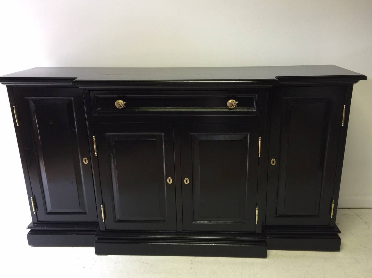 This is a vintage pine piece that has been newly lacquered in high gloss black. The interior was left unpainted to reveal the beautiful natural pine. One-drawer crosses the front, which stands out from the remainder of the piece about 4 inches. The