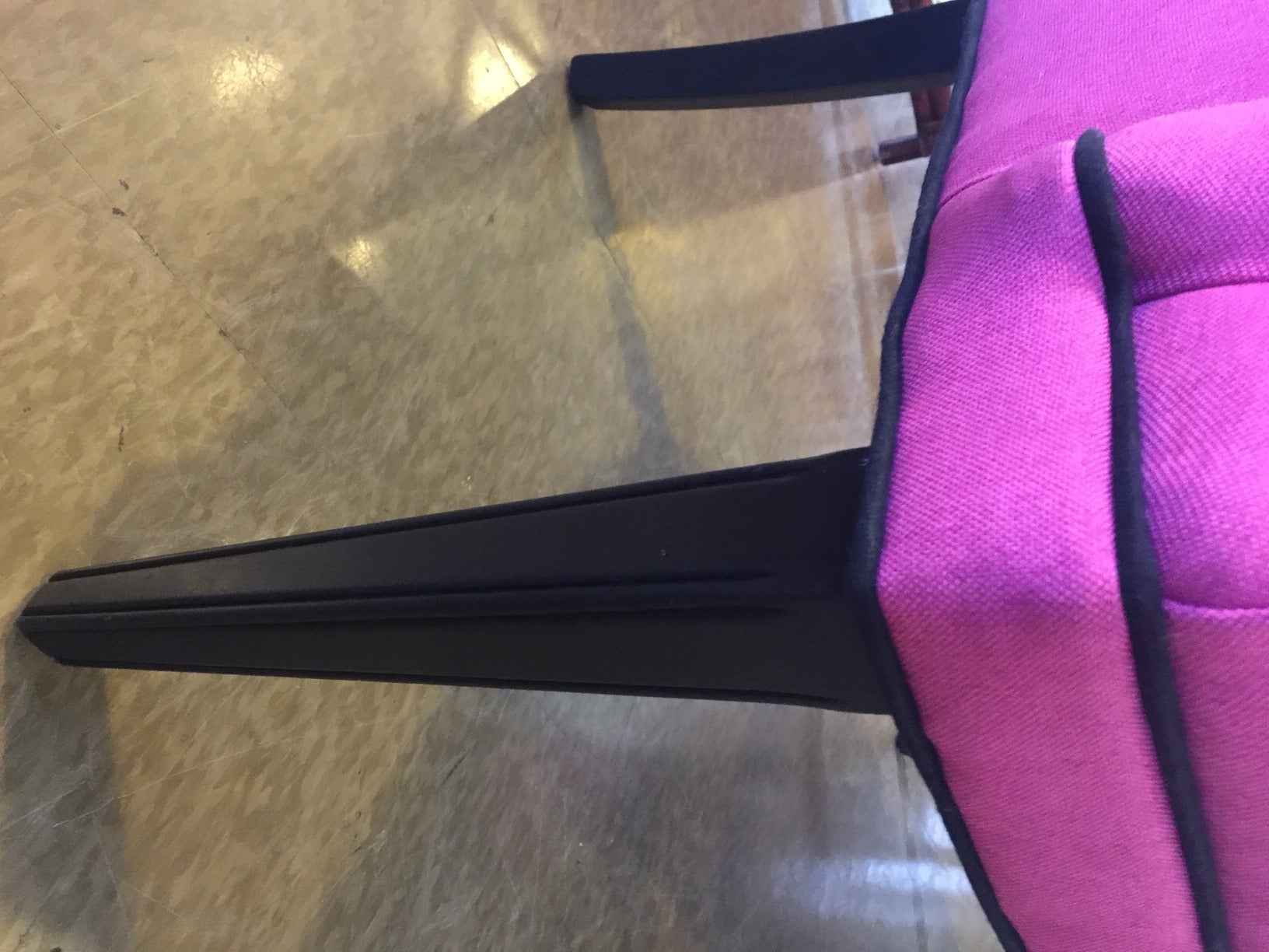 These vintage chairs have been reupholstered in a hot pink heavy linen with reinforced backing to retain the shape and keep this chair beautiful. It is corded in black linen and the legs and arm pieces have been professionally lacquered in black