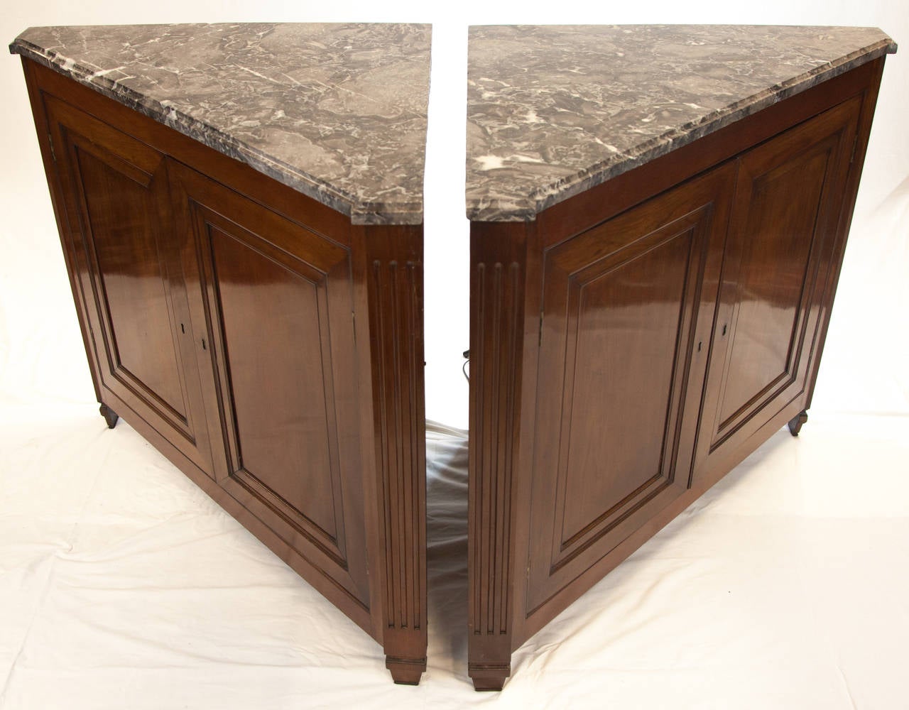 Pair of beautiful Directoire matching corner mahogany cabinets.