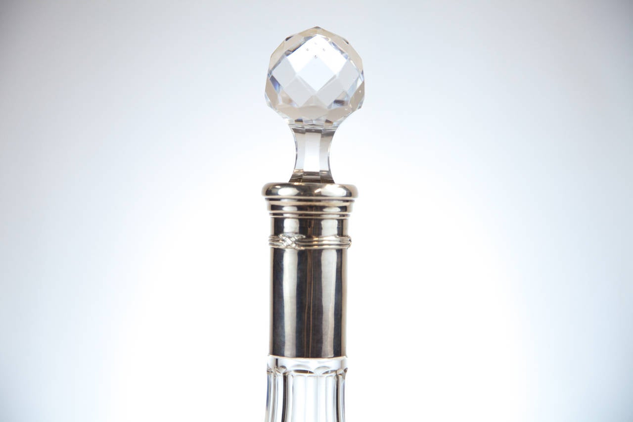 Beautiful crystal decanter with a silver neck.  Most likely made in Leige, Belgium