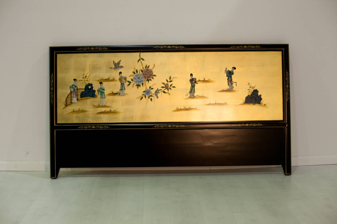 This immaculate headboard depicts a courtyard scene on a shimmering gold background,  The figures are carved from soapstone. The back of the headboard (and it could easily be reversed) is painted bamboo rendered in soft gold. The headboard itself is