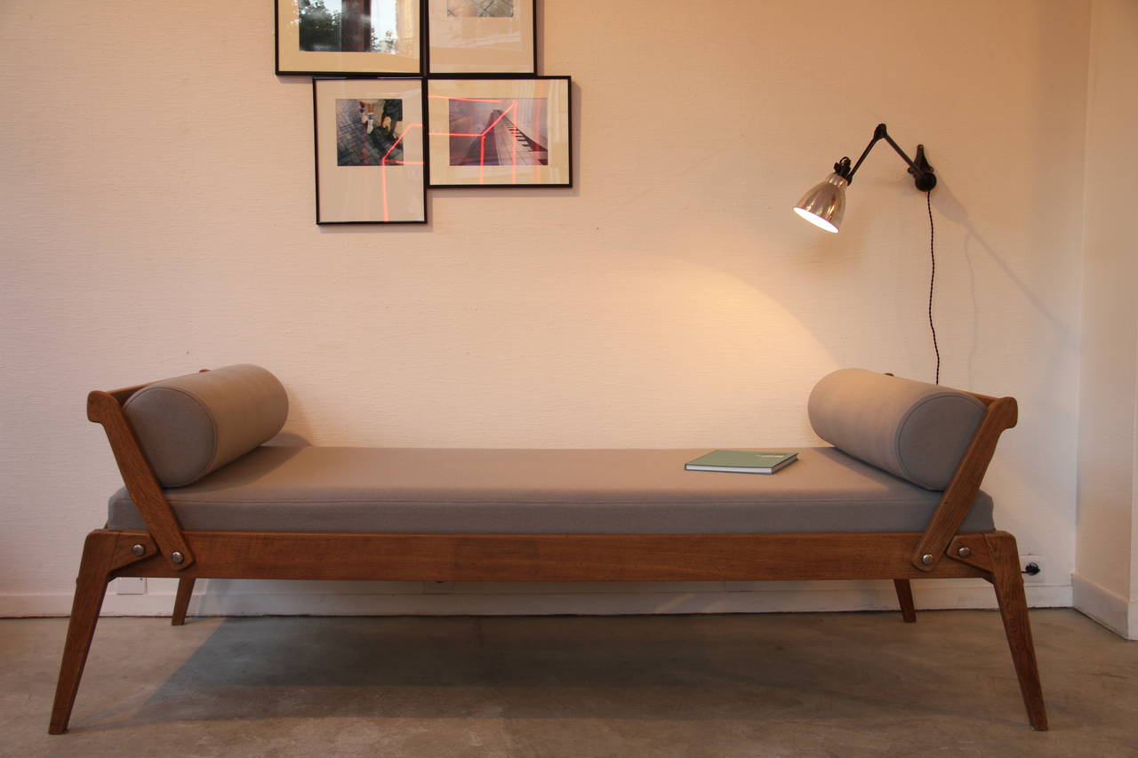 Oak folding daybed by René-Jean Caillette.
Edited by Charron, circa 1952.
New foam and wool fabric (Kvadrat.)