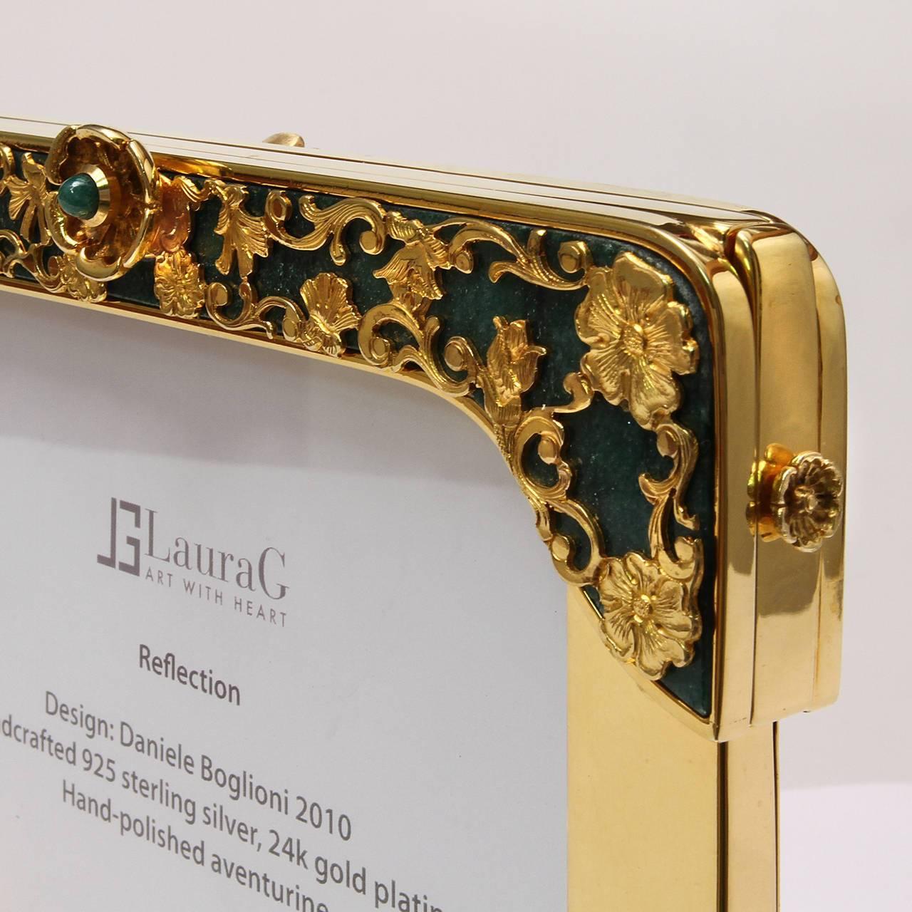 Reflection is gilded silver floral double photo frame with aventurine stone, a jewel photo frame signed Laura G Art with Heart. It is handcrafted in 925 sterling silver golden and it is a top piece of the collection Art with Heart.Delicately  formed