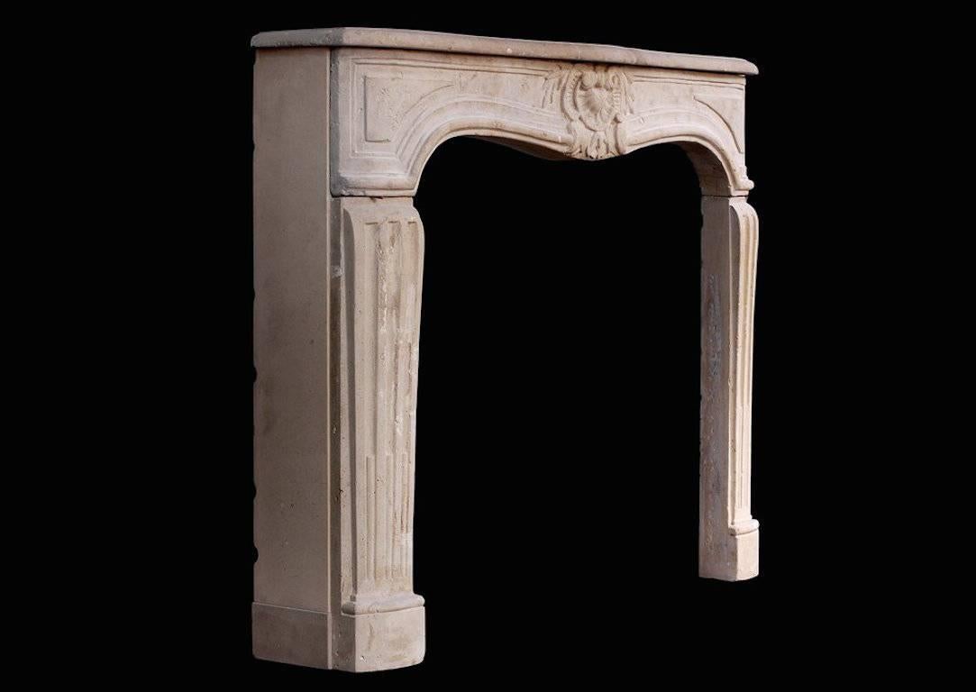 An attractive 18th century French Louis XV limestone fireplace. The panelled frieze with carved shell to centre and foliage, the shaped jambs with stop-flutes. Moulded shelf.

Shelf width - 1302 mm 51 ¼ in.
Overall height - 1022 mm 40 ¼