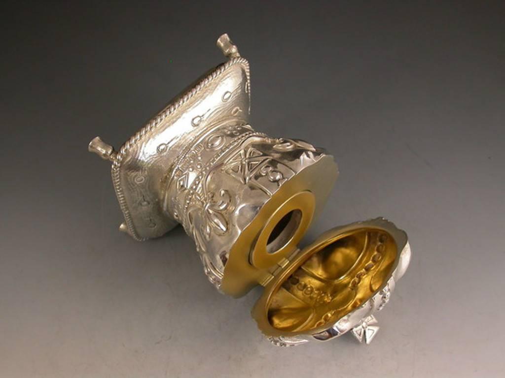 An unusual early 20th century novelty silver inkwell made in the form of Edward VII's coronation crown seated on an ermine cushion. The hinged lid opening to reveal a silver gilt interior with silver mounted glass ink pot.

By Thomas Ducrow,