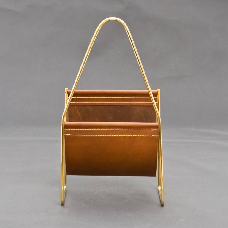 Classic Carl Auböck newspaper tray in a polished brass and taint leather. Outstanding piece! #3808.