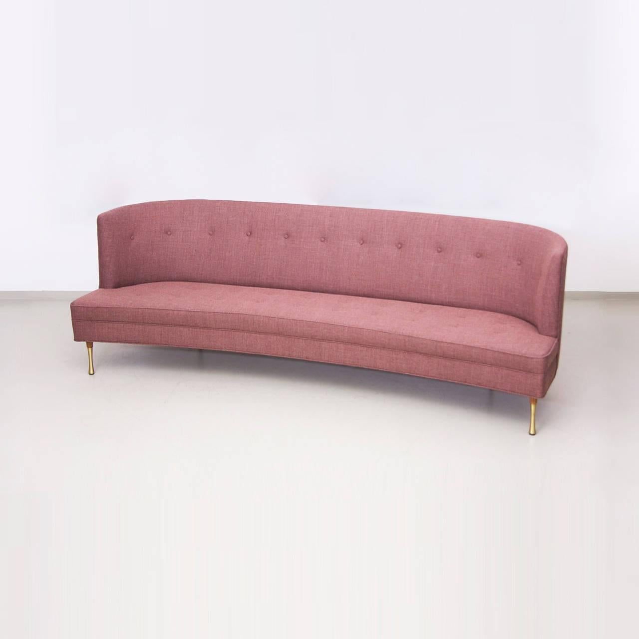 Rare curved sofa by Kipp Stewart for Directional in Kvadrat / Maharam fabric. Solid brass legs and a very feminine design.