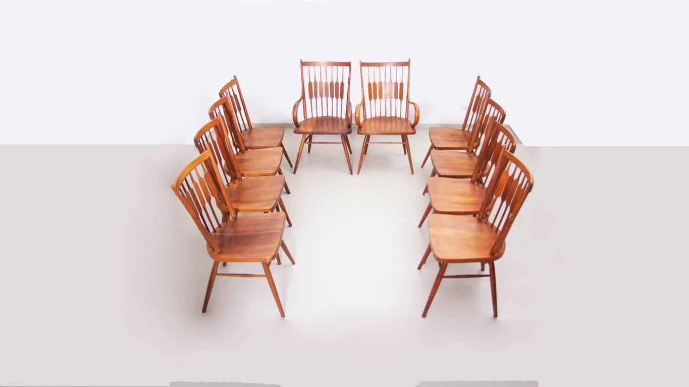 Rare set of ten Kipp Stewart chairs. Eight side and two armchairs in solid walnut by Drexel.

