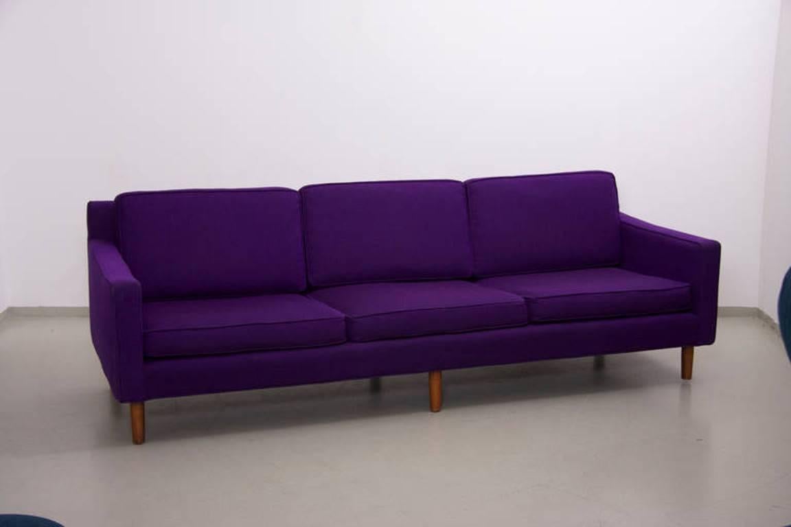 Rare loose cushion sofa by US designer Harvey Probber with solid wood legs. Vintage upholstery ready to get a new dress but can also be used as is!