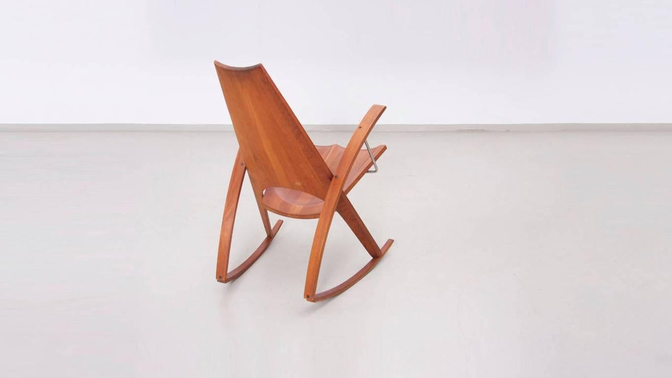 Rocking armchair by Leon Mayer in walnut and metal. Well handcrafted piece of art!

