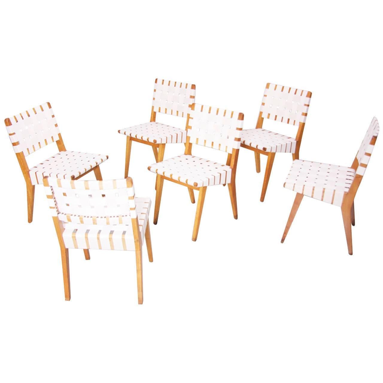 Set of ten side chairs by Jens Risom with new webbing and in solid birch. Signed!

