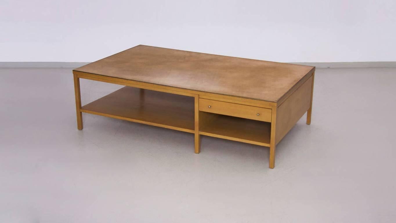 Rare Paul McCobb coffee table with leather top for Calvin. Legs show some wear of usage, but in overall good condition.

 