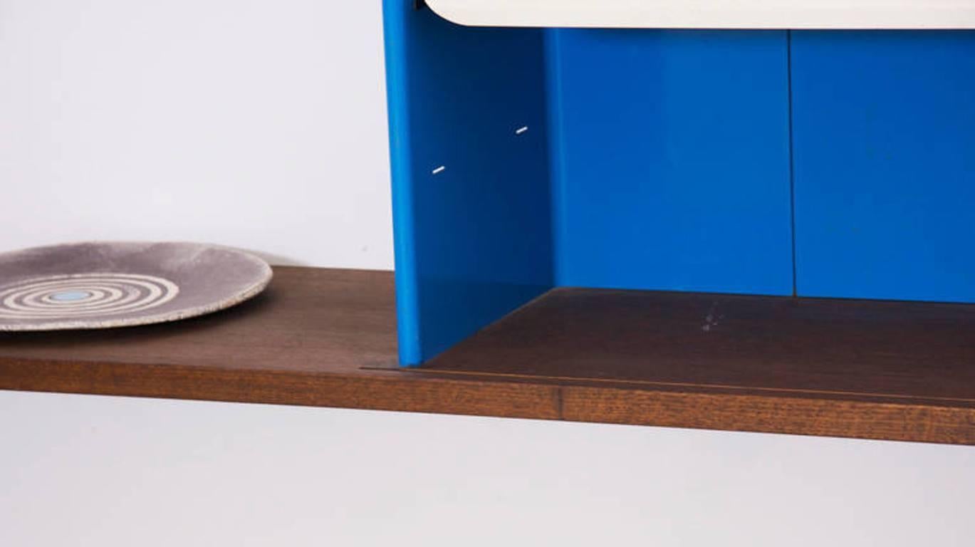Bookcase made of oak frame with lacquered bent steel racks. 
Cabinet features one sliding door concealing three adjustable shelves.
Jean Prouvé Bookcase type Antony, 1955. 
Only 86 pieces built in total.

The bookcase was created for the