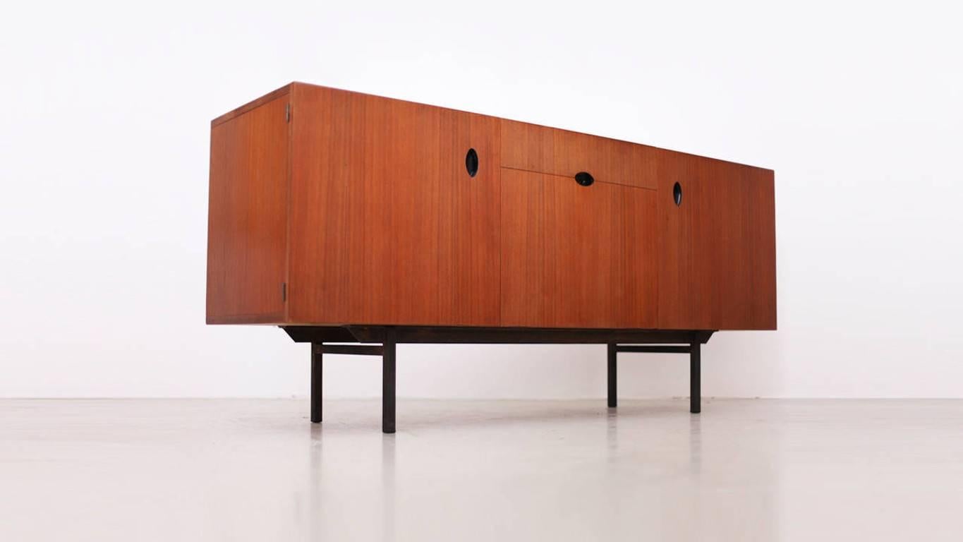 Paul Geoffroy sideboard for Bobois in teak in excellent condition. The handles are very unique and give this square shape something really naive.

 