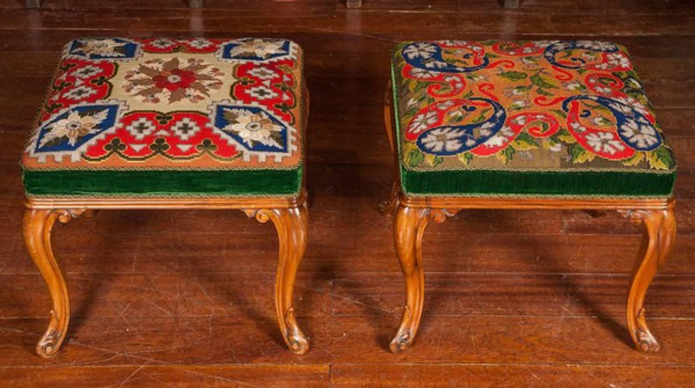 Fine Berlin needlework stools.
 
An extremely rare pair of exhibition quality walnut cabriole leg stools
each bearing its original cover.
 
The style of the stools, the complexity of the needlework and the inclusion of glistening cut steel and