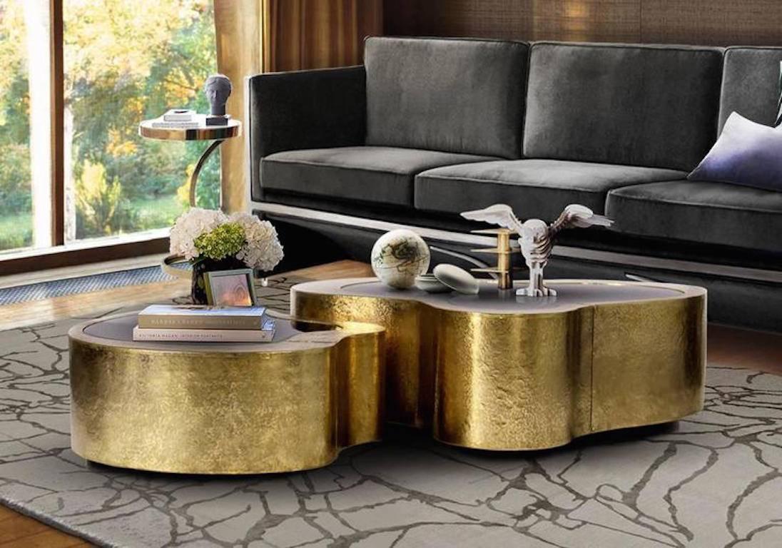 Glamorous large and small ensemble of matching coffee tables. Made in wood finished with manually hammered copper with a curvilinear top made from black mirror. The base is lacquered in black finished with a high gloss varnish.
Large table: W 96, D