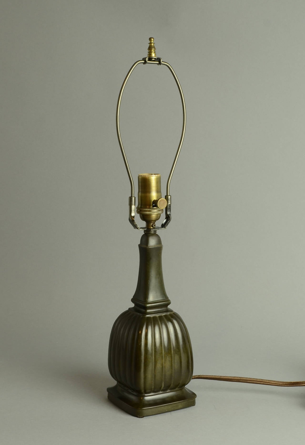 Table lamp in disko metal, c. 1930s. Rewired with antique brass style fittings, and brown fabric cord.