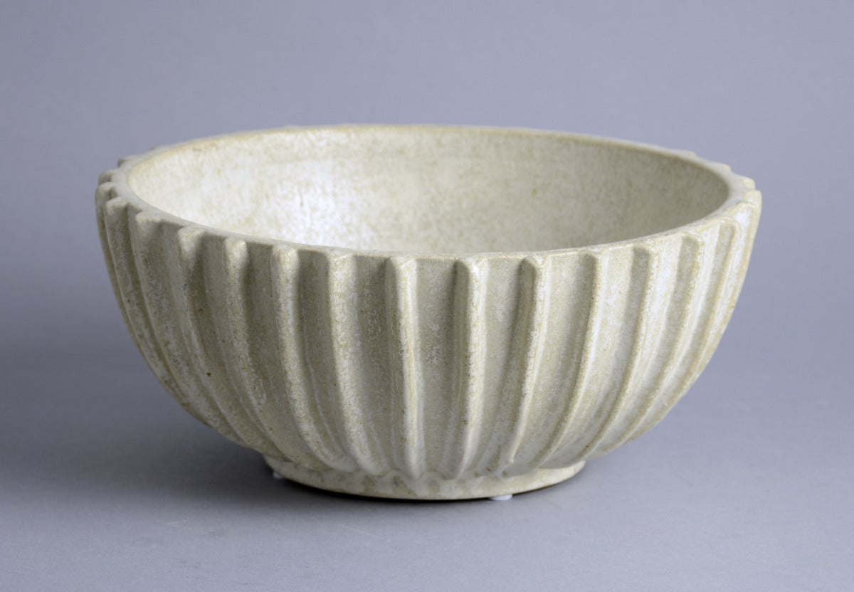 Arne Bang, own studio, Denmark
Stoneware ribbed spherical bowl with off-white matte glaze.
Height 4 3/4