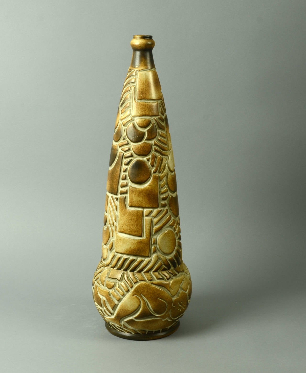 Unique earthenware vase with carved surface and matte glaze in brown and cream, 1930s.