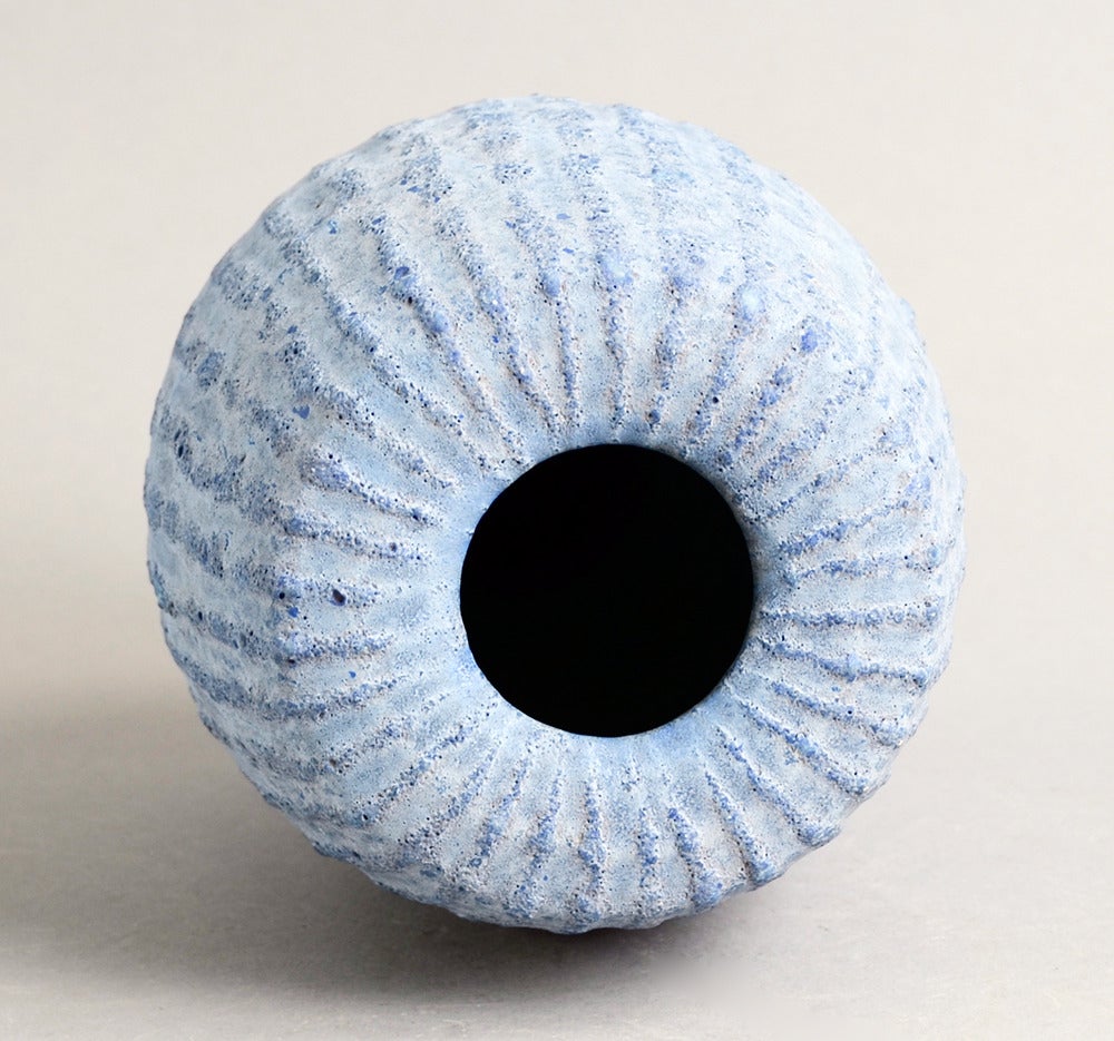 Unique stoneware ribbed vase with pitted matte blue glaze, circa 2000s.