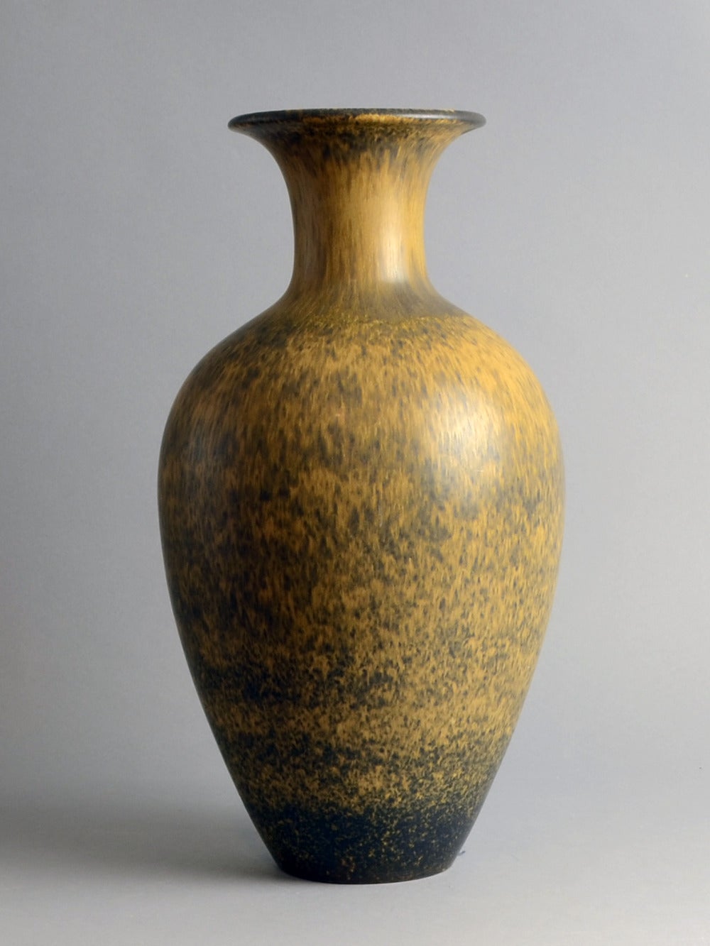 Stoneware vase with matte brown and yellow ochre glaze, circa 1950s-1960s. 
Incised "R (three crowns) Sweden GN AKT"