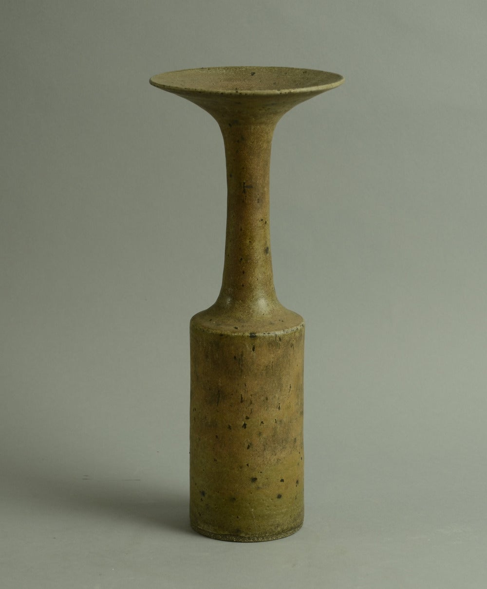 Unique stoneware vase with flaring rim and matte brown glaze.