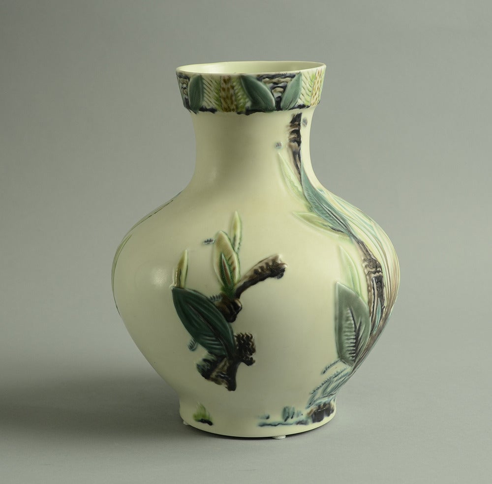 Hand-carved, hand-painted porcelain vase with floral decoration of a magnolia blossom in relief, multichromatic glaze, 1910s.