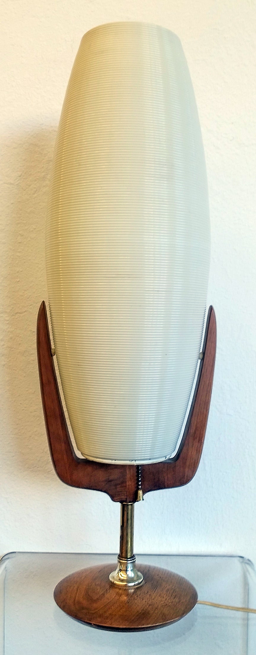 Rotoflex table lamp on a pierced walnut base, with walnut accents.