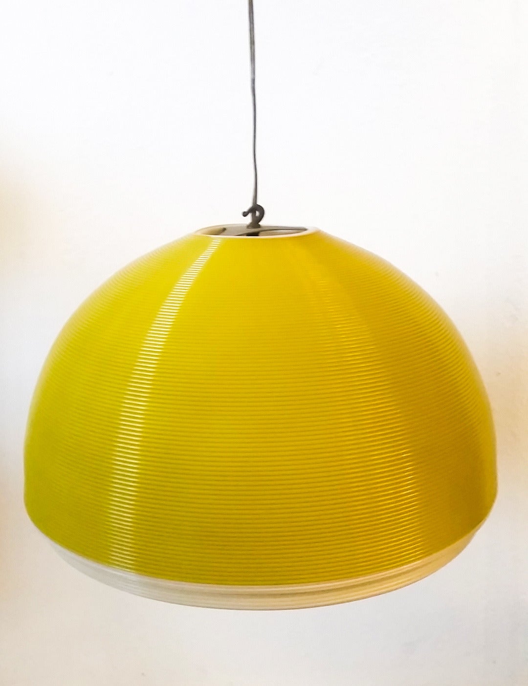 A 1950's mid century modern hanging Rotoflex pendant light with honeycomb diffusers by Heifetz. This mid century modern hanging chandelier pendant light is not only bright yellow and modern, it's clean enough that without knowing, one might think