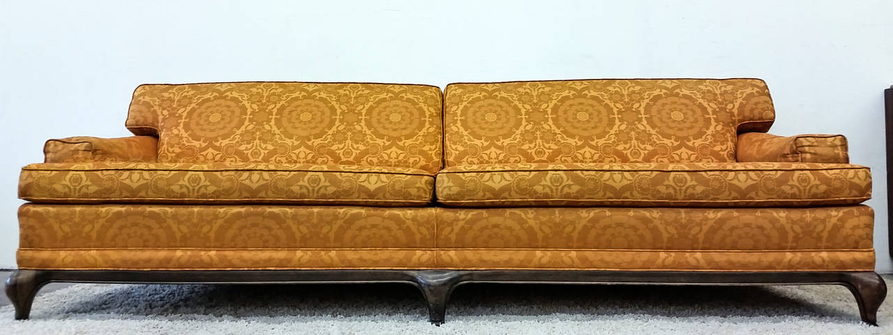 With modern lines and upholstered in an orange damask pattern, this sofa is both timeless and chic.

A custom sofa designed by Maurice Bailey and manufactured by Monteverdi Young for the New York Stock Exchange firm James H. Oliphant & Co. This