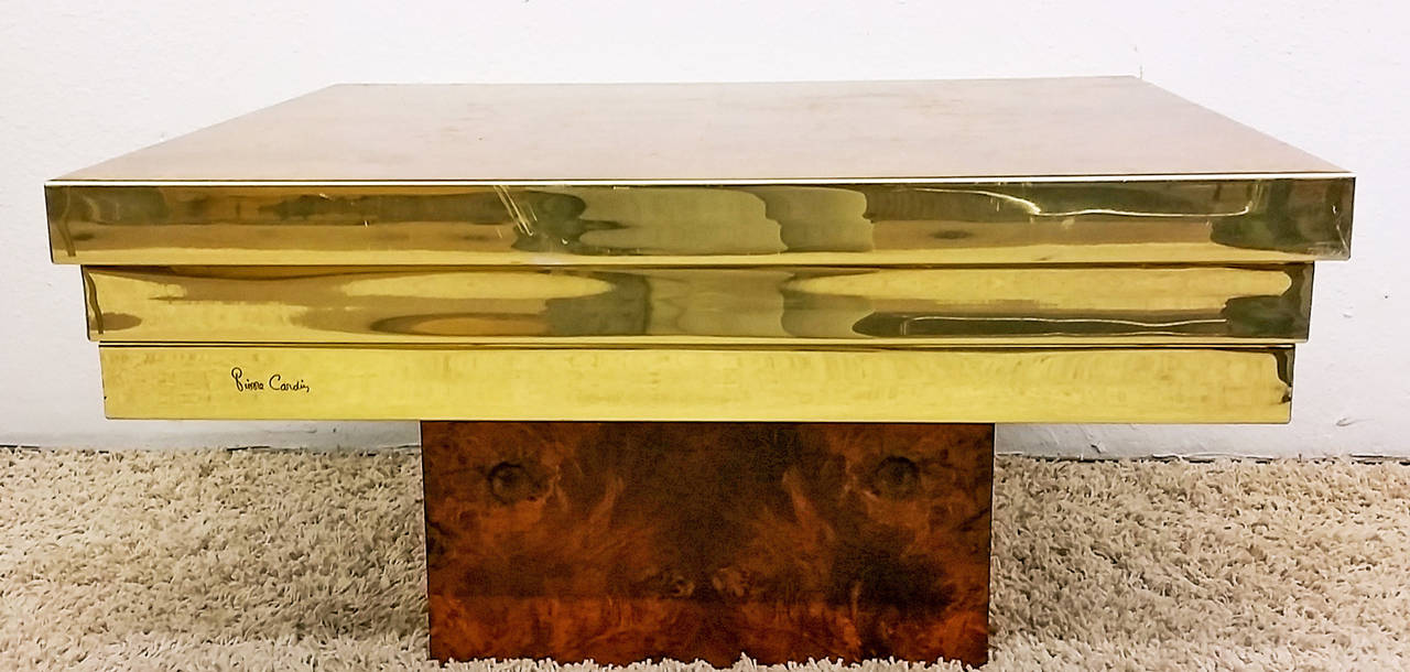 A stunning Pierre Cardin brass and burl wood coffee table. The table is in excellent condition with just a couple minor scuffs on the brass which can be seen in the photographs.
