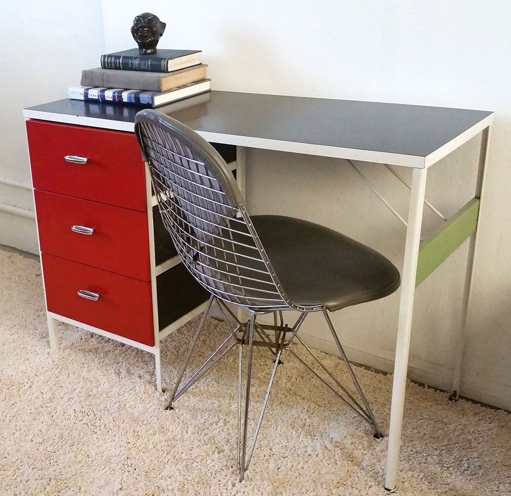 Gorgeous rare George Nelson steel frame desk by Herman Miller with red painted drawer fronts and chartreuse side piece. Simple, classic and stunning design! 

The desk has some fading on the black laminate top, very light rust, and just wear to