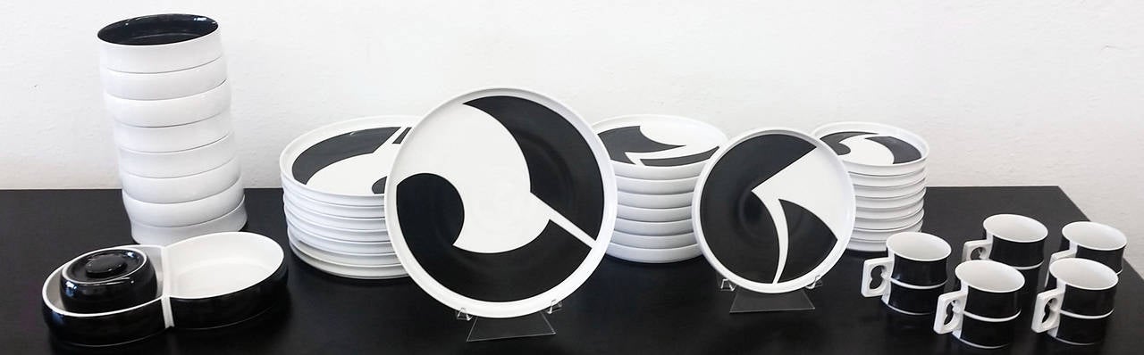 Dine in style! An incredibly rare vintage set of block games chromatics dinnerware set. The set features dinnerware settings for eight (eight dinner plates, 10 3/8