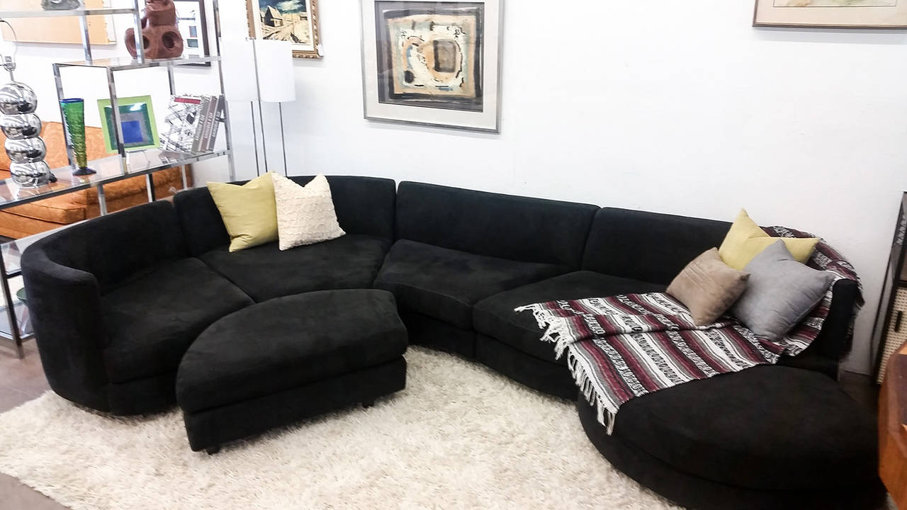 A stunning example of 1970s modern design, this Cy Mann serpentine biomorphic sofa is a stunner. The sofa is upholstered in a black suede and is in great condition! 
(Six pieces and can be arranged to preference).
Dimensions as photographed.
As