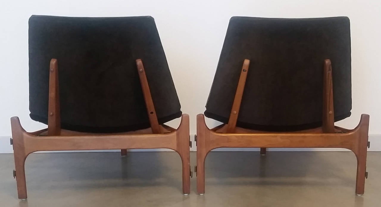 A stunning pair of all-original John Keal 3 legged lounge chairs for Brown Saltman. The chairs still feature their original hardware and can be 