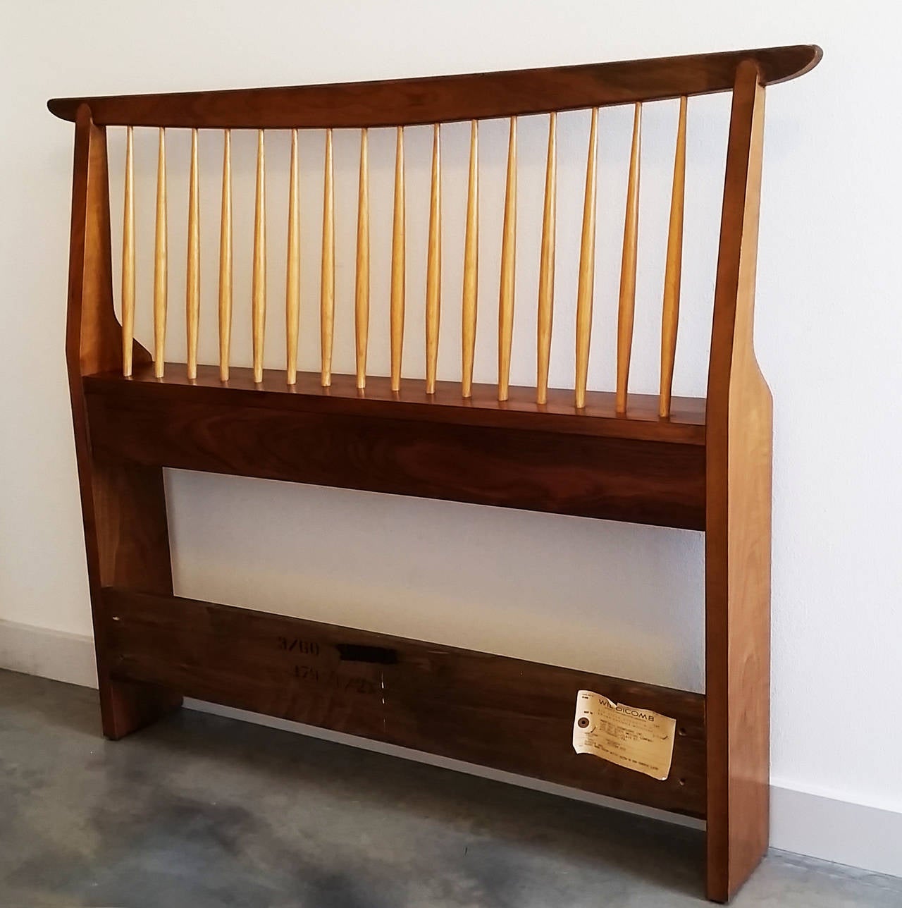 A truly stunning and Classic design, this George Nakashima twin headboard features the clean lines and elegance that Nakashima is known for. This piece is in excellent still has the original paper tag and is part of Nakashima's origins line for