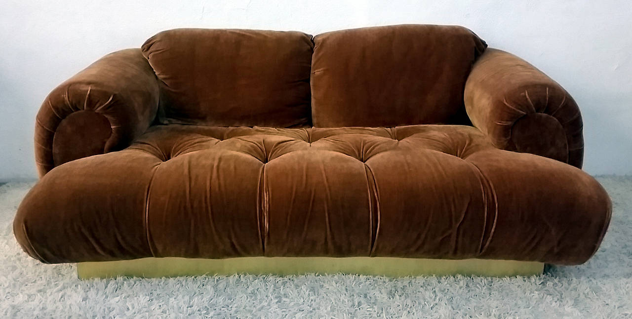A stunning piece, this 1970s Italian modern style sofa is upholstered in its original rust colored velvet fabric.